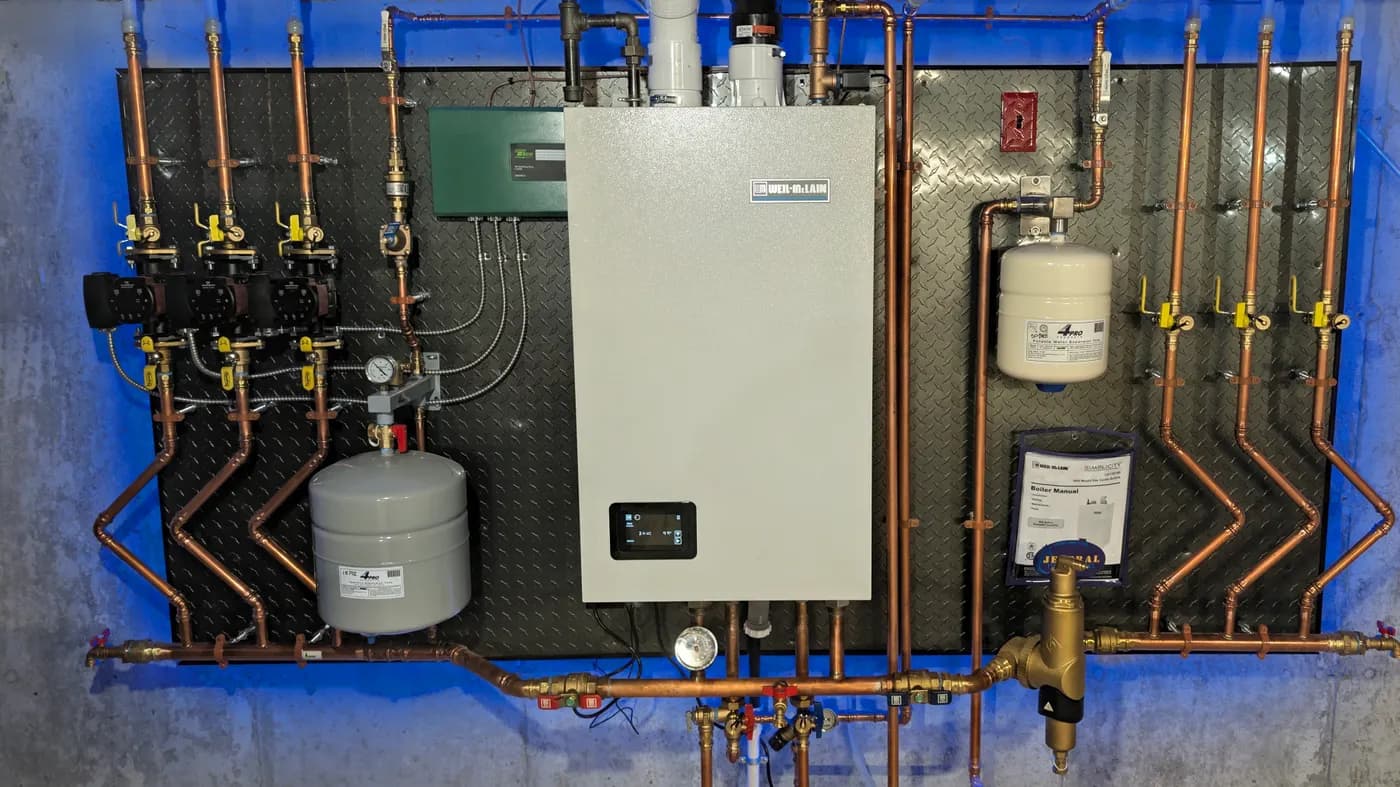 Weil-McLain Simplicity combi boiler and connected piping installed by Jeneral Plumbing