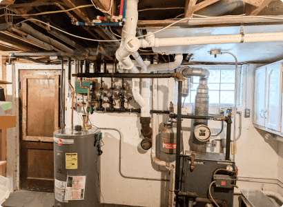 Accessible residential drain piping prepared for inspection and repair