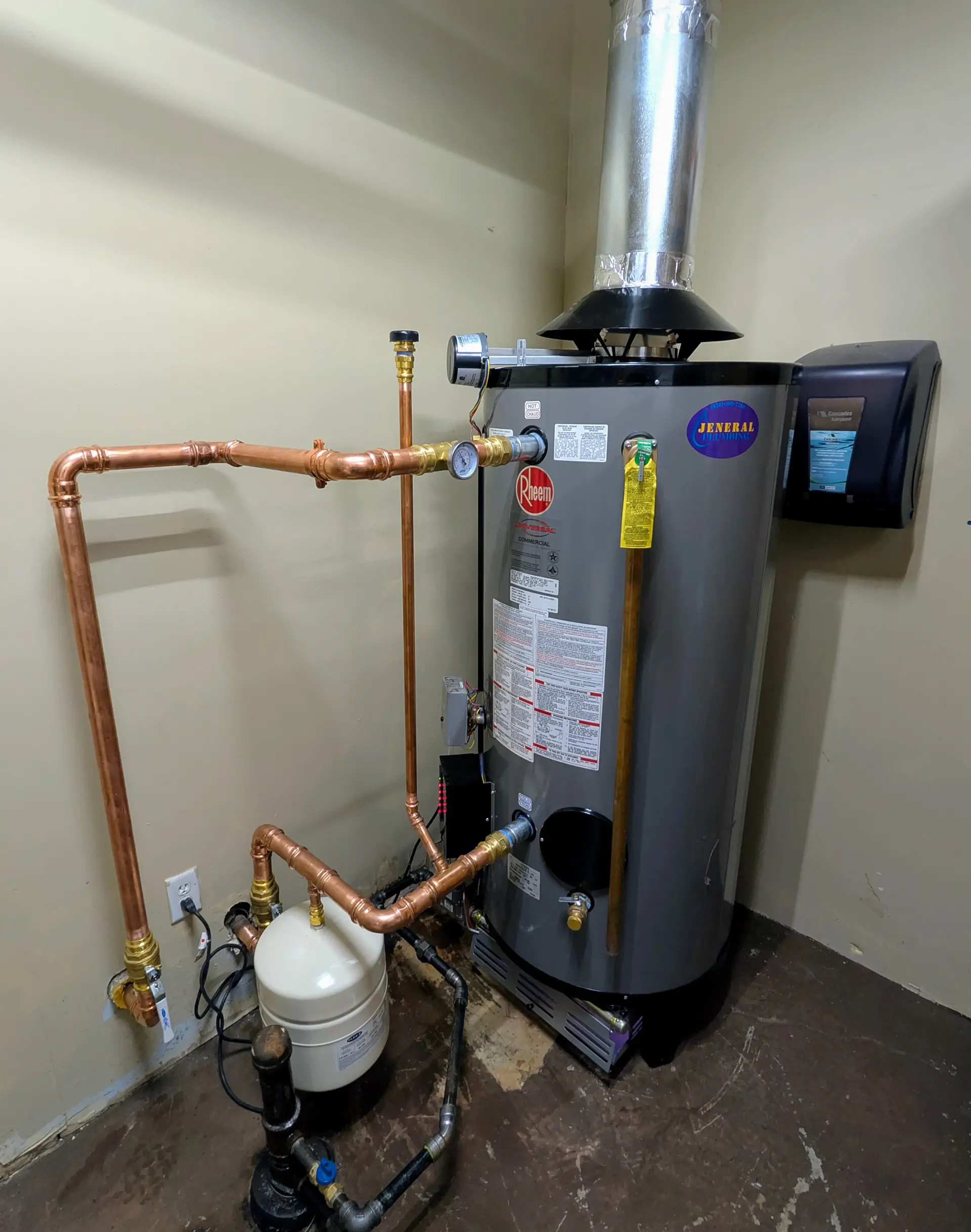 Rheem chimney-vented gas water heater with draft hood, expansion tank, and copper piping