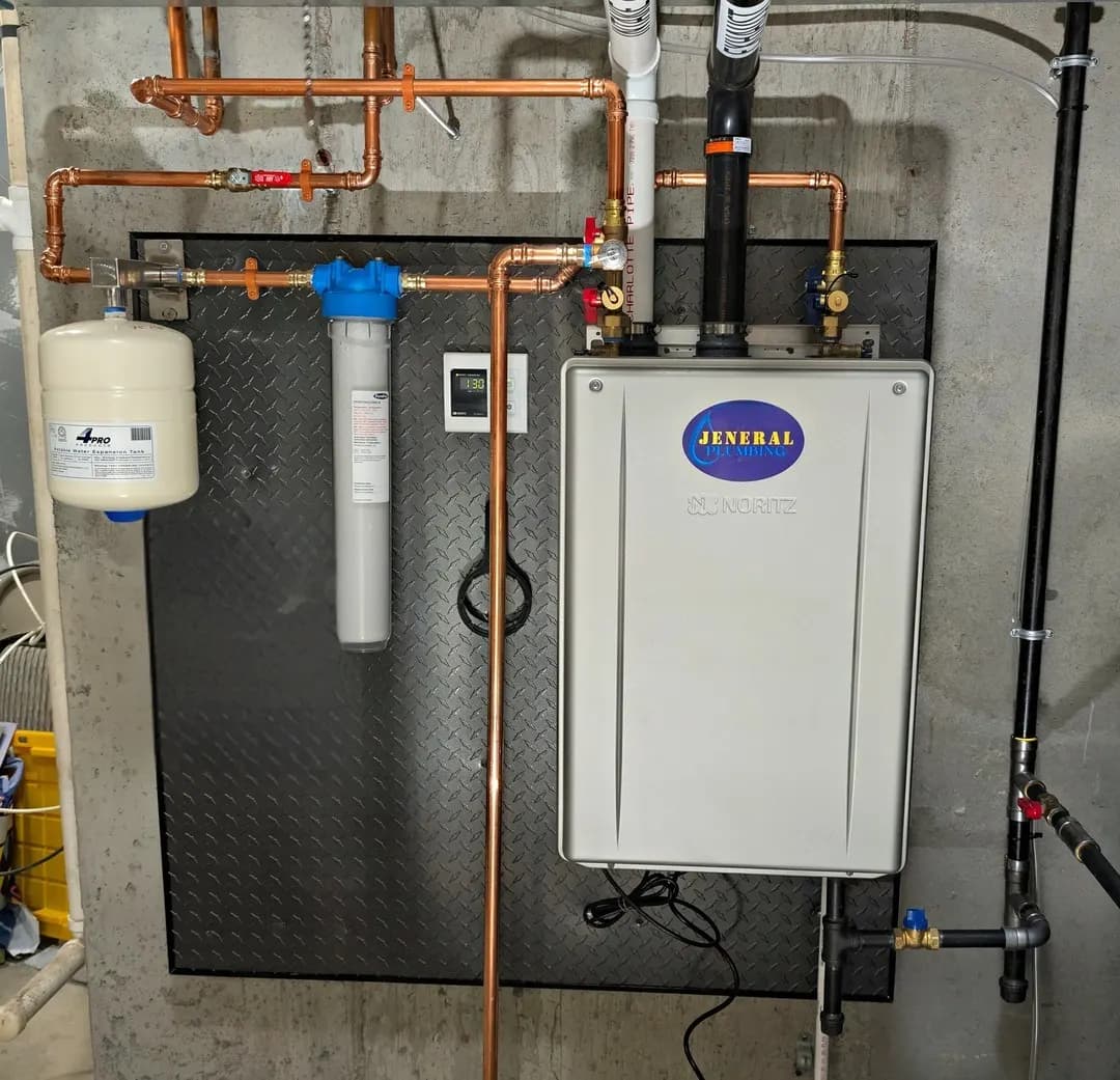 Noritz condensing tankless water heater with sediment filter, expansion tank, and temperature controller installed by Jeneral Plumbing